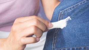 girl getting gum out of clothes